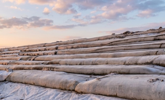 Geotextile socks filled with sand contain hazardous materials